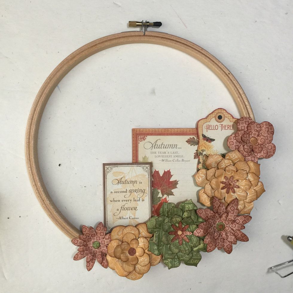 Add your flowers to the embroidery hoop rim.