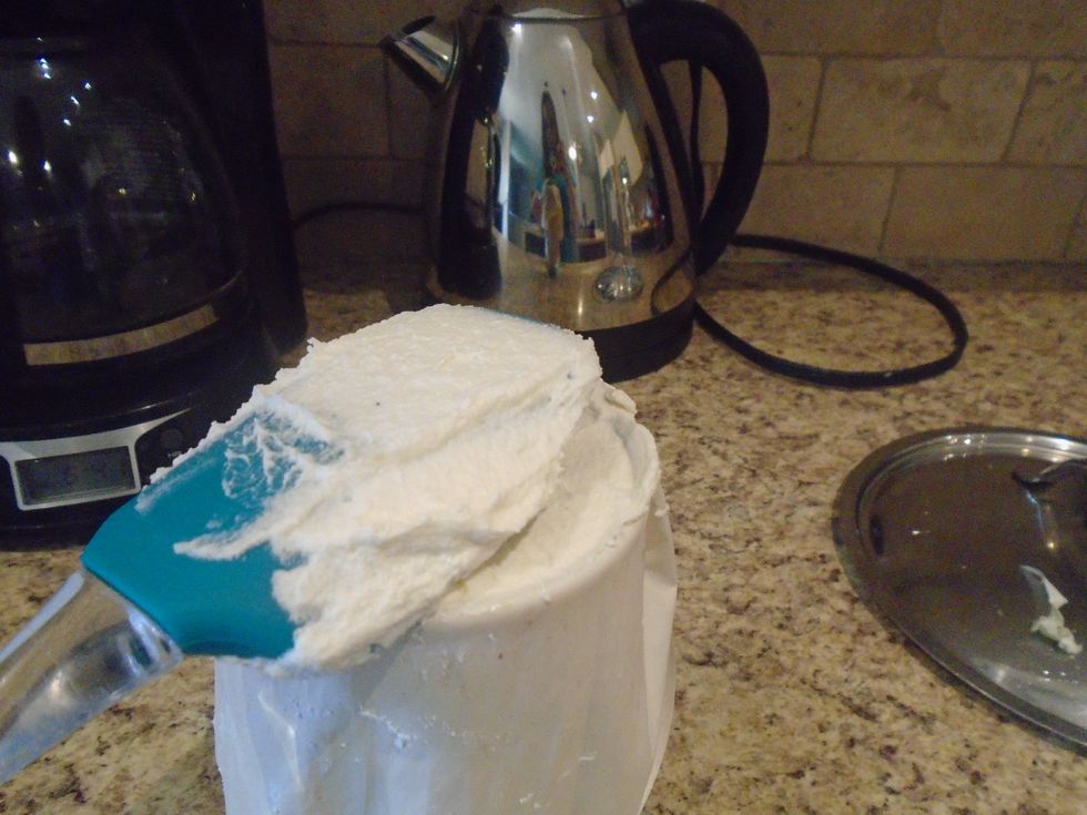 Add your frosting making sure its in line with glass rim.