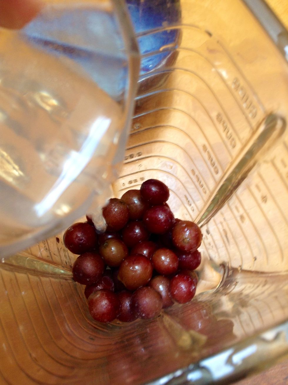Add your frozen grapes and lemonade! Make sure that your grapes aren't completely frozen or else they'll stall your blender! \ud83c\udf3b