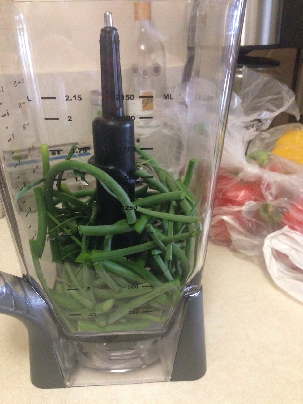 Add your Garlic Scapes into your mixer.