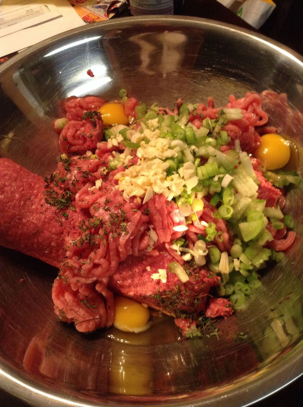 Add your green onions, thyme, tomatillo, garlic, 4 eggs, 3 pinch of cumin and add salt to your taste. Drain the rice and rise very well and add to meat.
