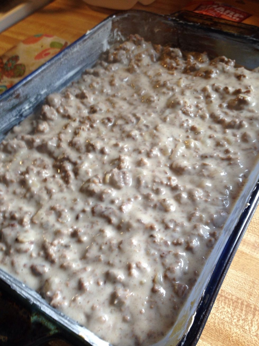 Add your ground beef mixture and even it out in the pan....