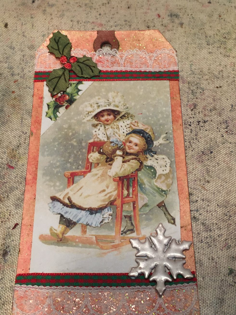 Add your holly leaves and snowflake.