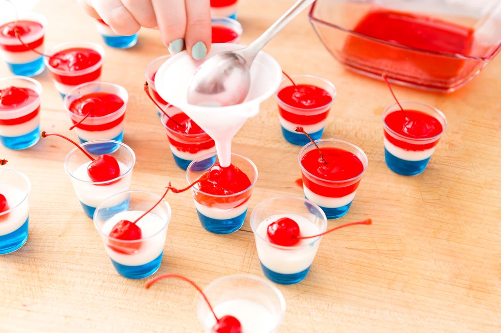 Add your last layer of JELL-O, ensuring to cover the cherries. Refrigerate for 30 minutes or until completely set.