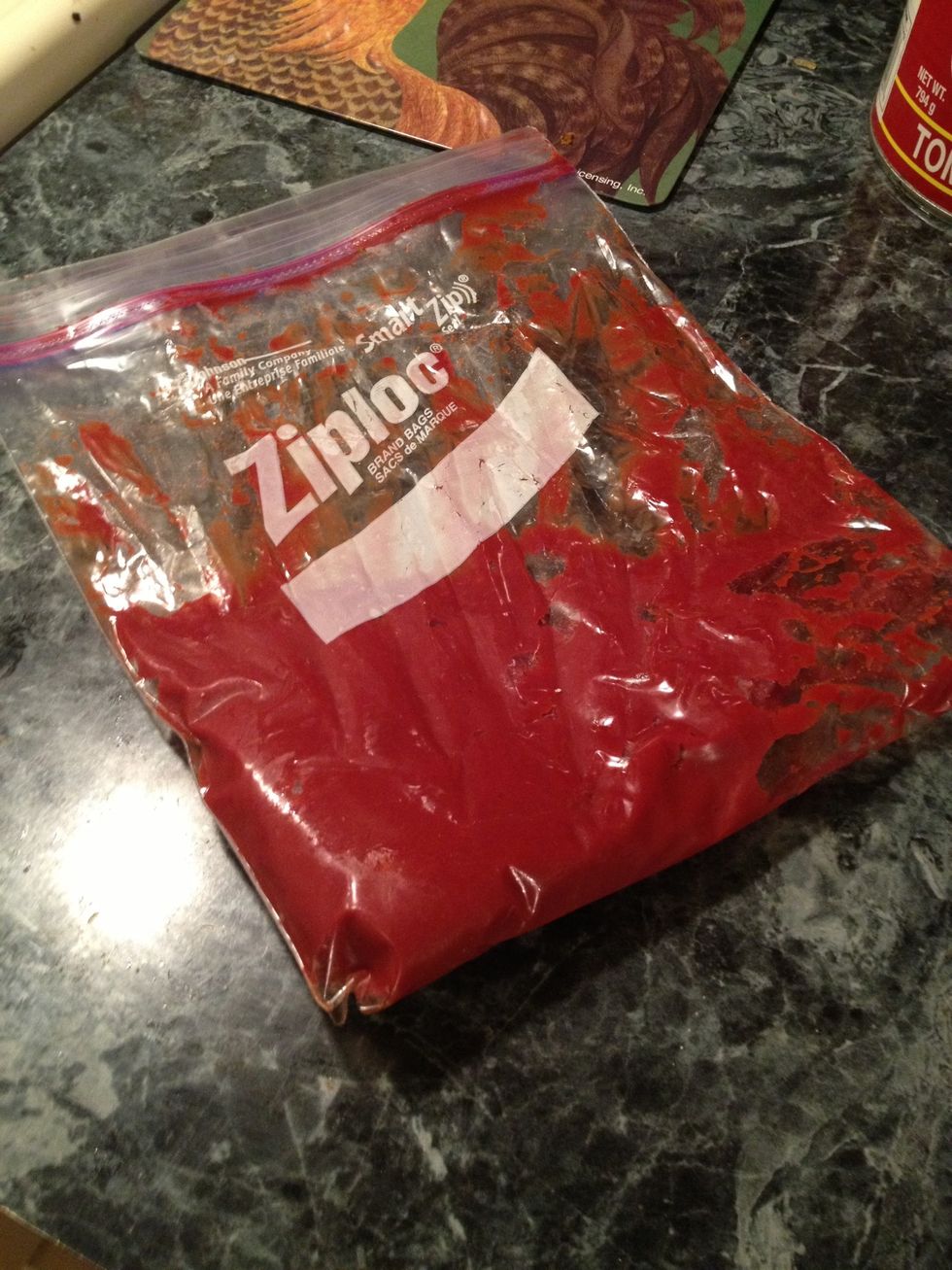 Add your leftover tomato paste to a ziploc bag. You don't have use this method, you can spoon it in the tray. I just find this way less messy. :)
