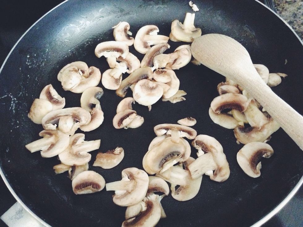 Add your mushrooms to the pan and coat in butter. Stir till almost fully cooked.