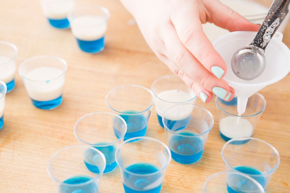 Add your next layer of the unflavored gelatine mixture to your shot glasses. Refrigerate for 10 minutes or until set.