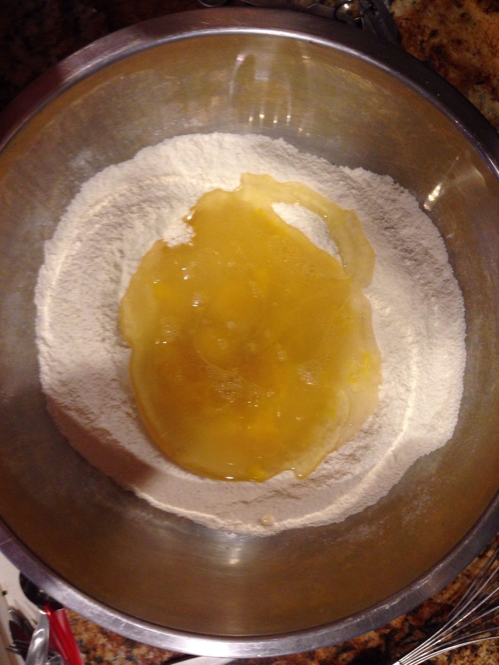 Add your oil, then egg yolks, then cold water. Stir for 30 seconds. Until just combined.