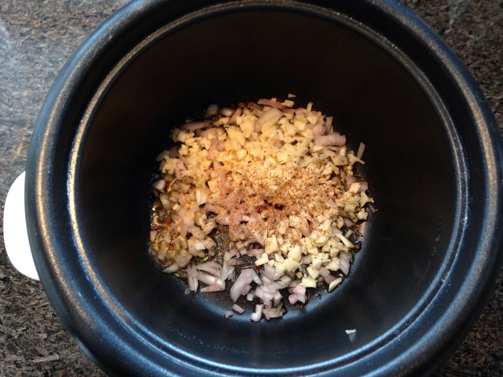 Add your olive oil, shallot, garlic, salt and pepper to the rice cooker