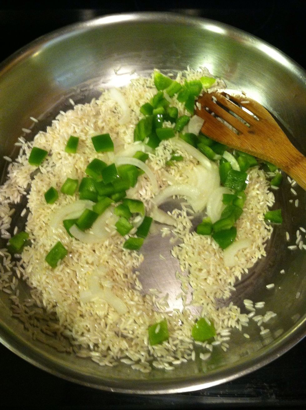 Add your onion and bell pepper, saut\u00e9 about a minute