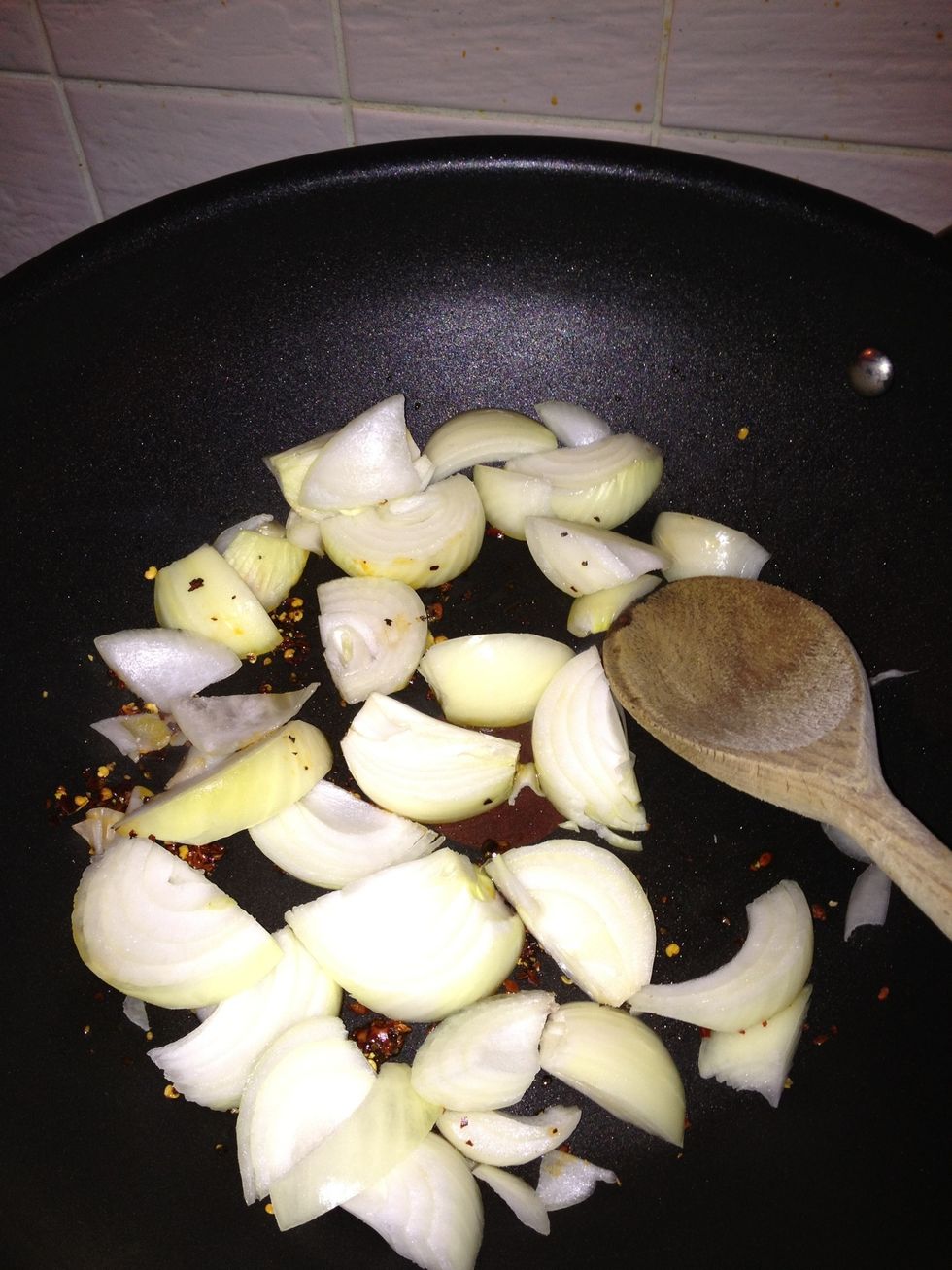add your onions and stir, lower heat to medium