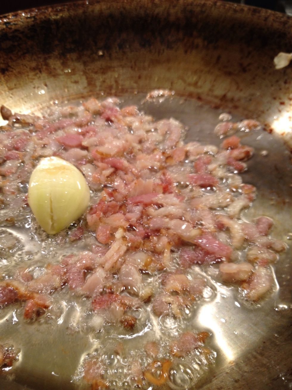 Add your pancetta and garlic and fry it together.