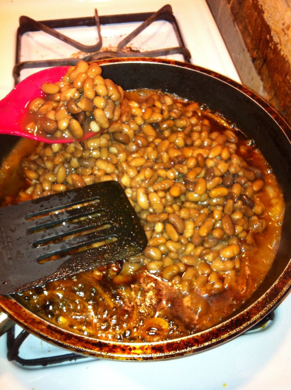 Add your pinto beans . Stir to a simmer.
