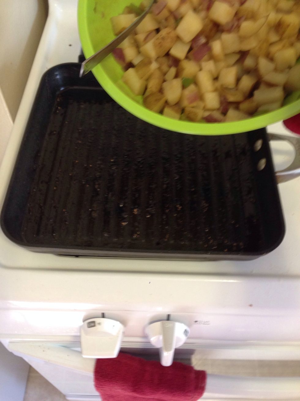Add your potatoes to a skillet with high heat.