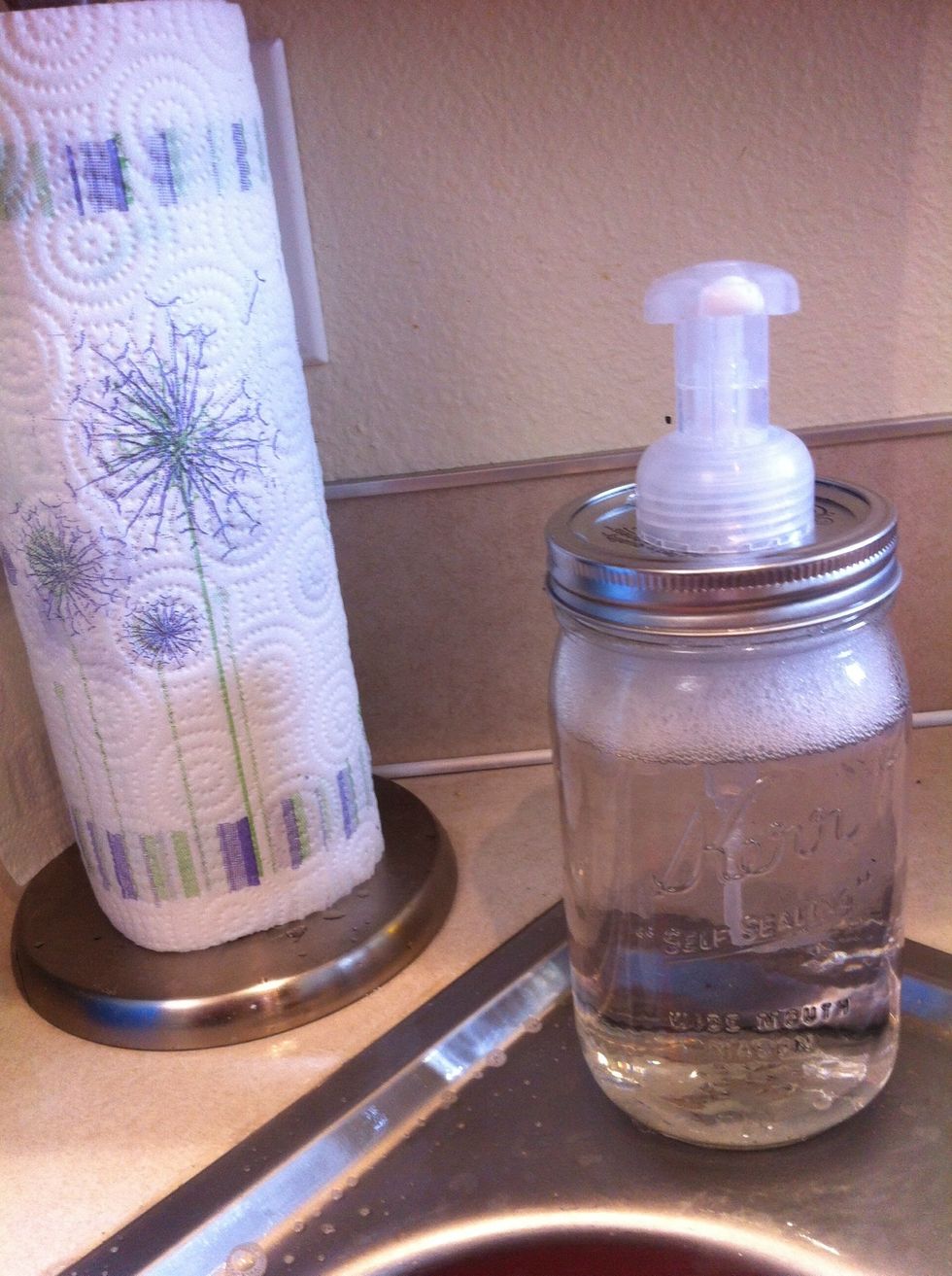Add your pump soap to a wide mouth mason jar and screw on top. Done.