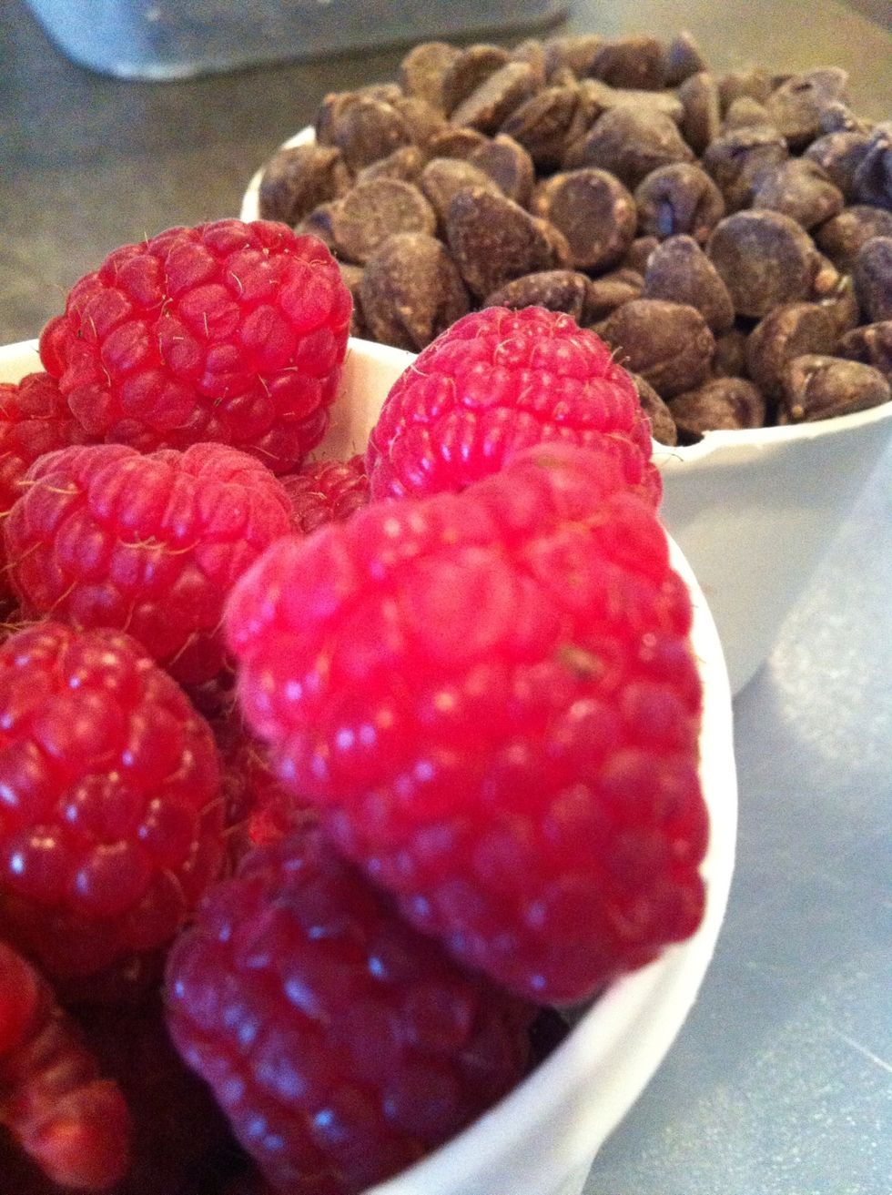 Add your raspberries and chocolate chips (I halved the raspberries as I put them in). You can also sprinkle chocolate chips and raspberries on the top to make it pretty