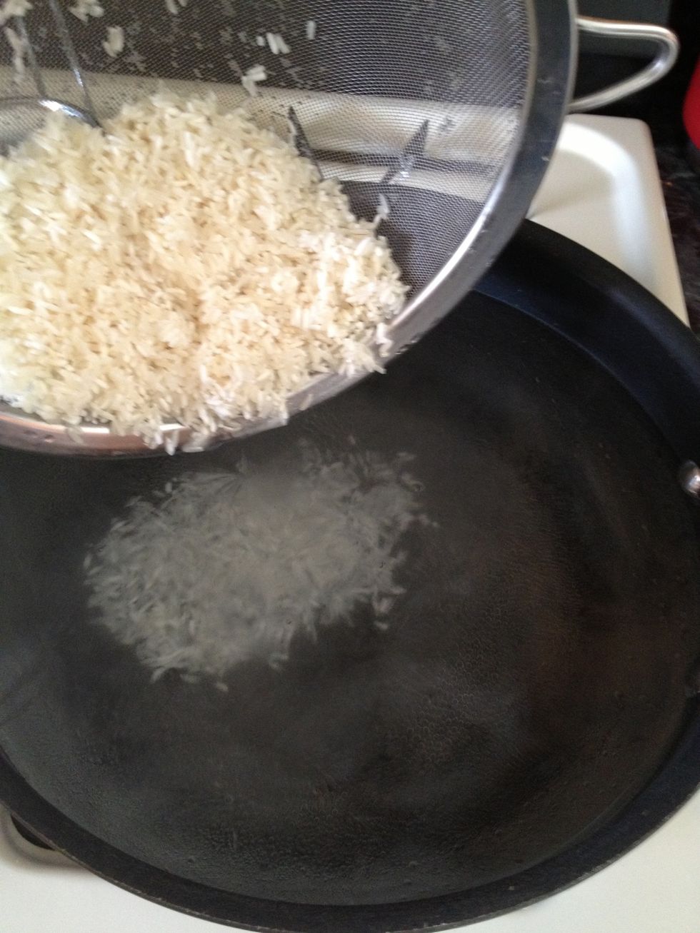 Add your rice to the water that has been placed in a pot over medium heat.