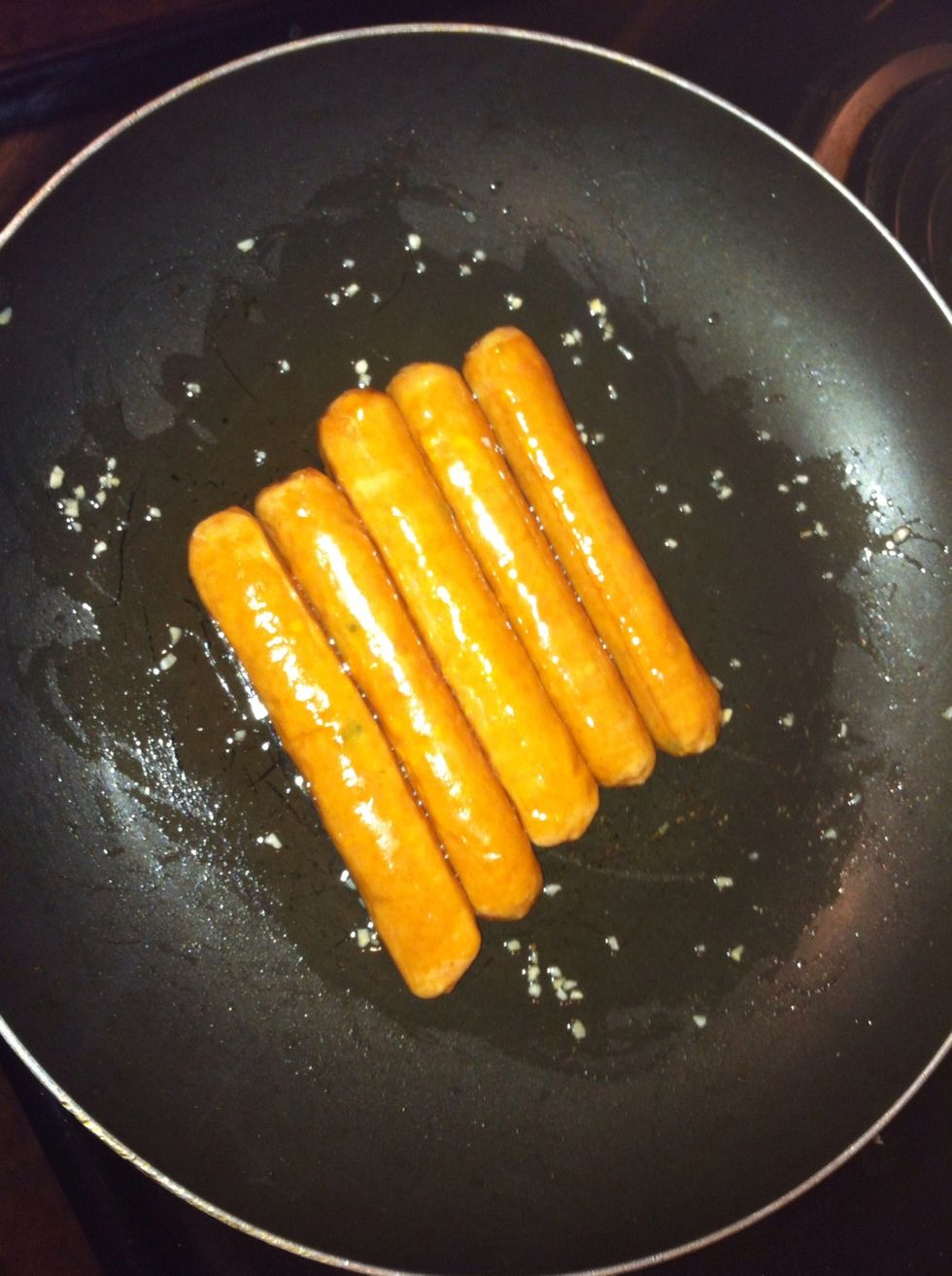 Add your sausages into that pan
