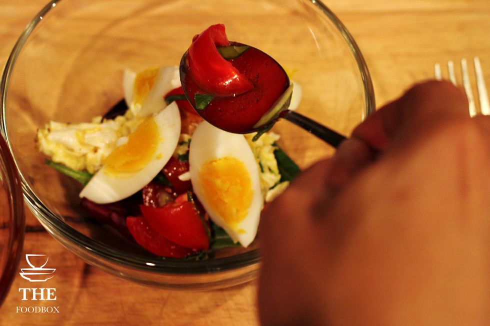 Add your seasoned tomatoes to the mixture as well onto the top.