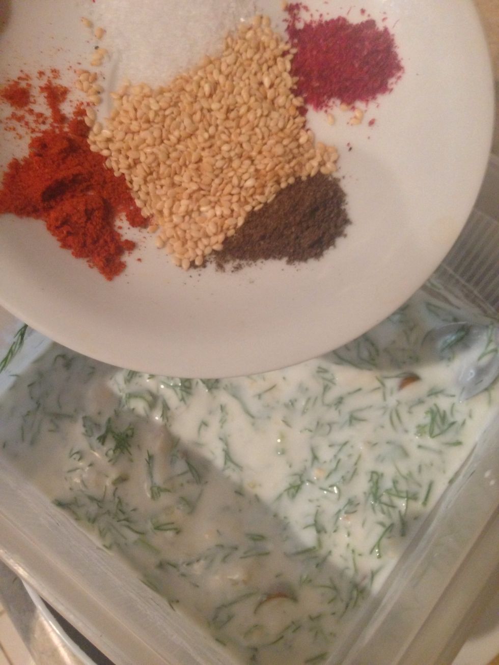Add your spices ( sumac, salt , paprika, dry mint ) and the sesame seeds.