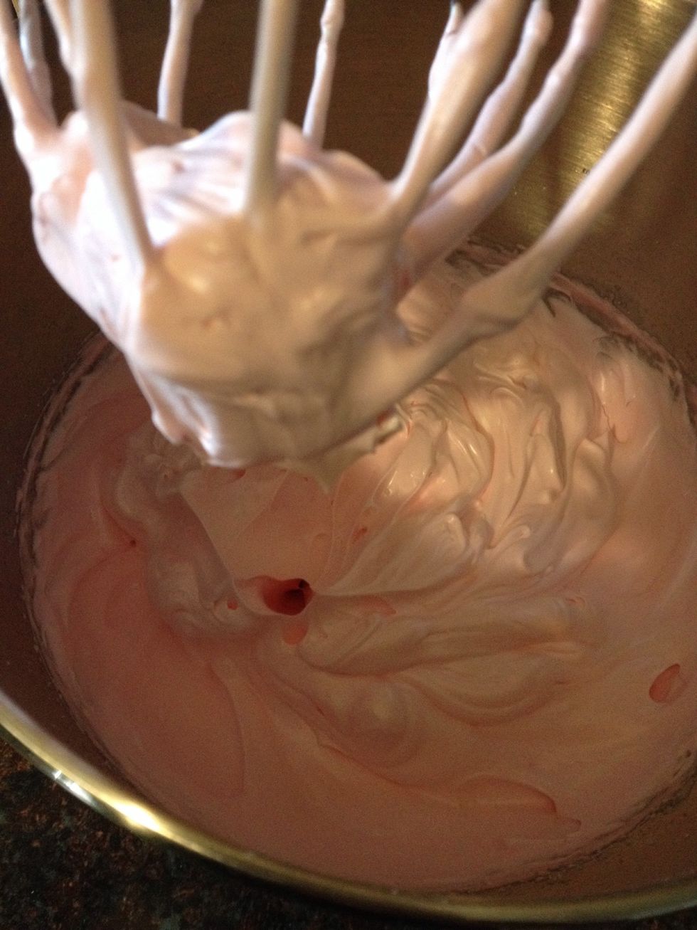 Add your sugar and some food coloring for the "strawberry" look. Whisk until soft peak