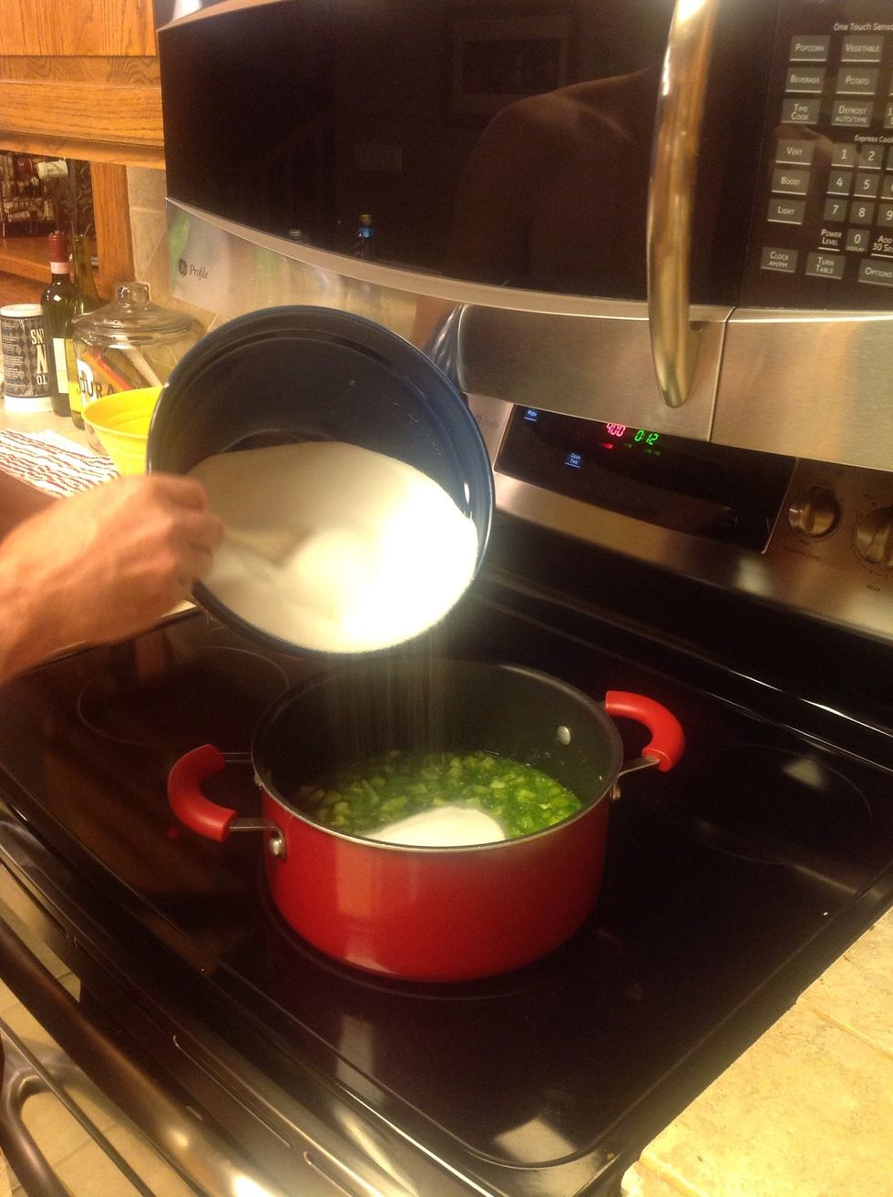 Add your Sugar and stir well. Bring to a boil and let it boil for five minutes.