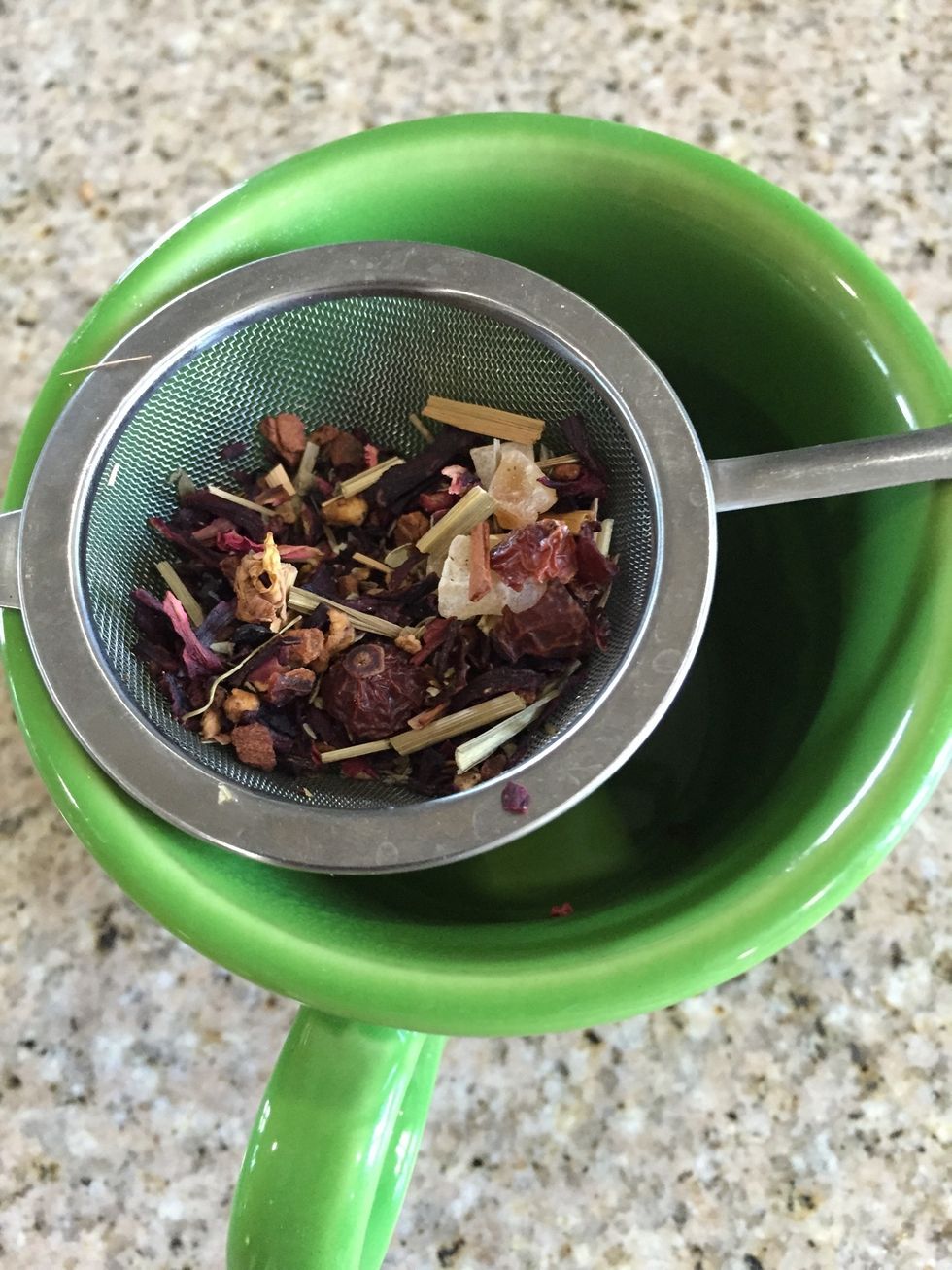 Add your tea to your infuser basket in the quantity recommended for your specific variety. Here we've used a tablespoon of an herbal blend.