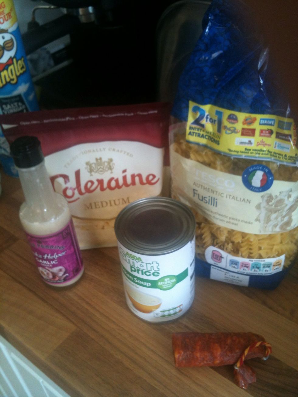 Add your tins of soup, pasta, a cup or so of grated cheese and your garlic, as you can see I've got for the really easy option with garlic sauce and store bought grated cheese :)