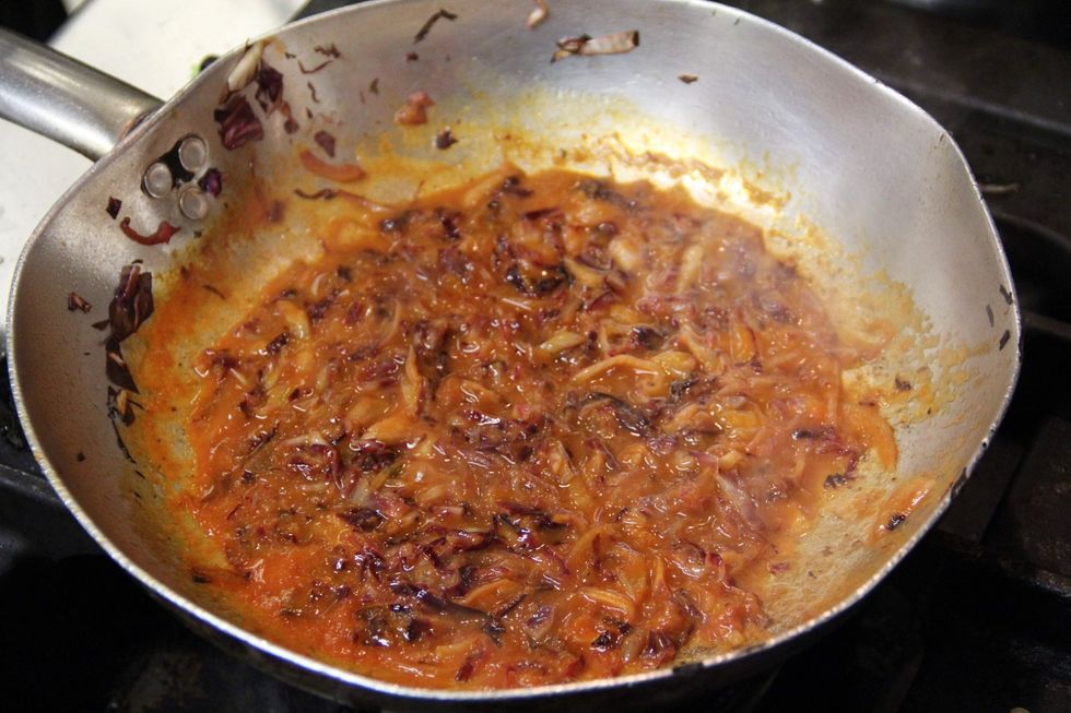 Add your tomato sauce. You can add a scoop of water from the boiling water that should be on stove for your gnocchi....this will help make a nicer sauce...