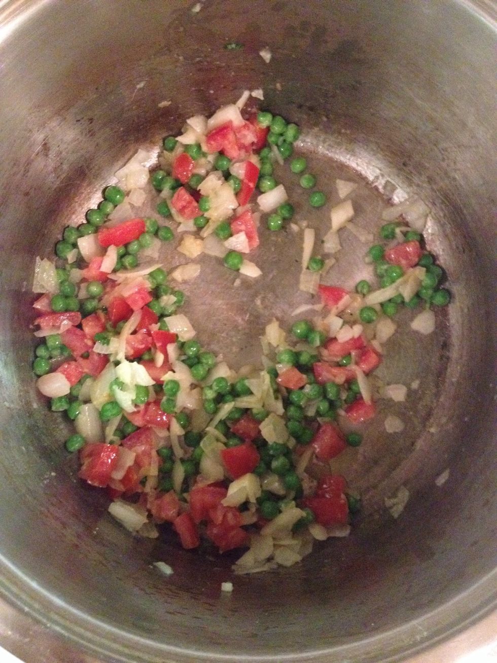 Add your tomatoes and peas..