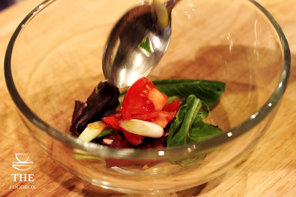 Add your tomatoes to the spring mix.