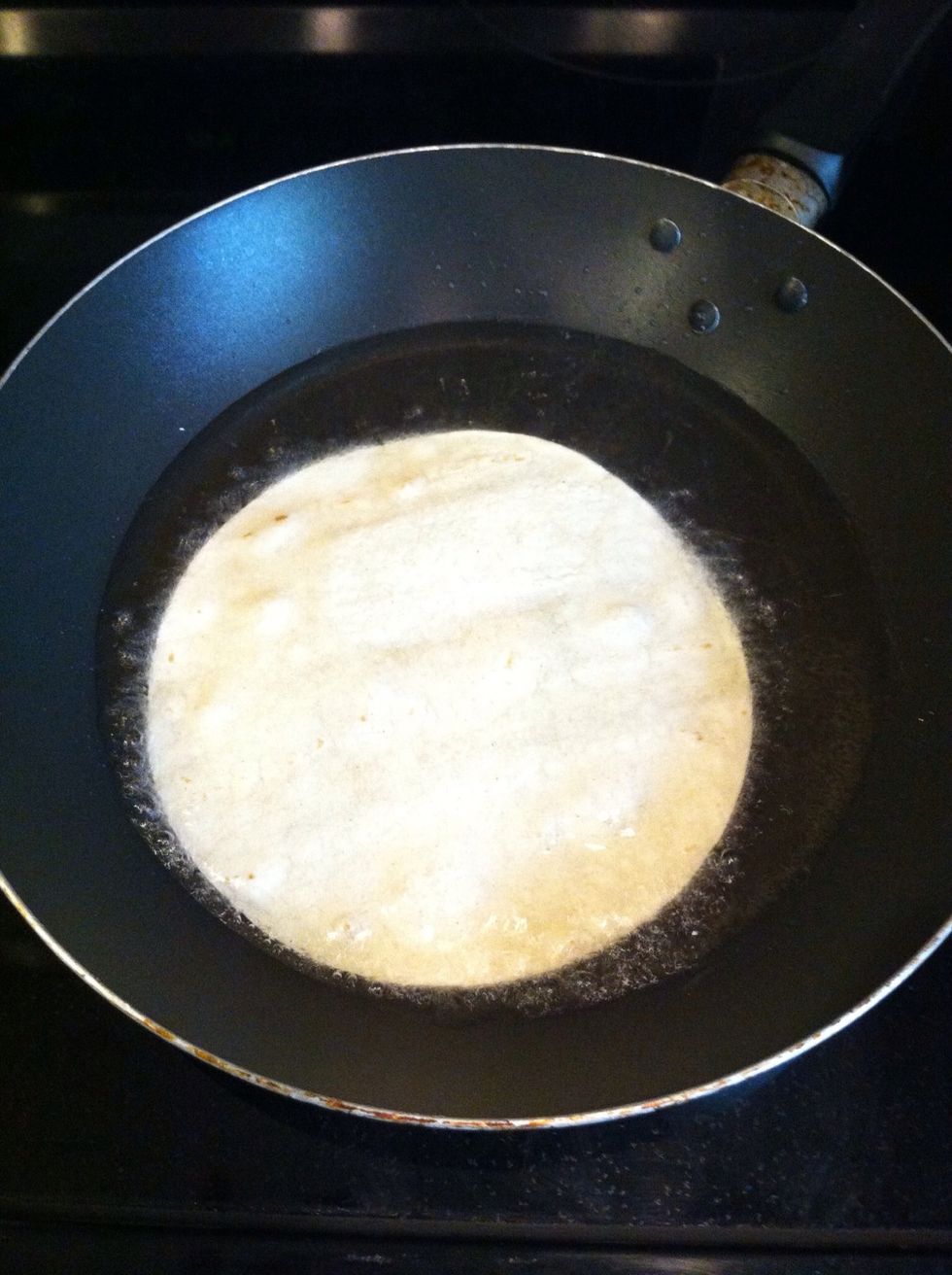 Add your tortilla. It usually takes anywhere from 30 seconds to a minute on each side. Keep an eye on it, so you won't burn it.