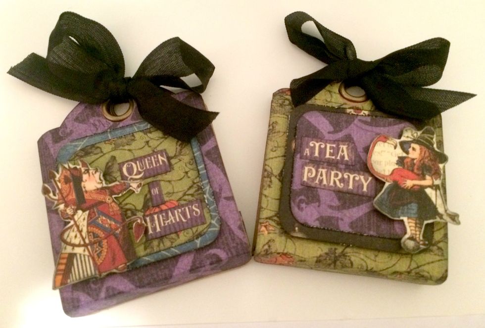 Add your treat inside of your tag and tie a bow using black ribbon. Your treat tags are now complete!