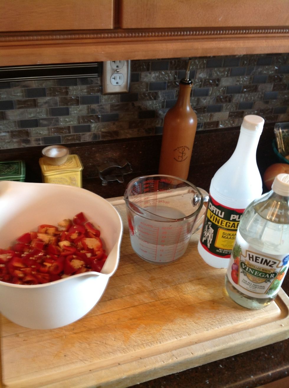 Add your vinegar to the bowl, you can go with straight white vinegar but I use half White and Half cane vinegar from the Phillippines. It's a little more mellow. But either way is fine.
