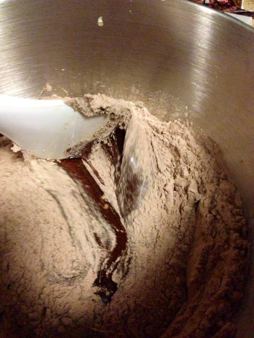 Add your wet mix now to your dry mix and again stir until fully combined. Stirring by hand gently to avoid over mixing. Once combined add your semi-sweet chocolate chips and fold into batter evenly.