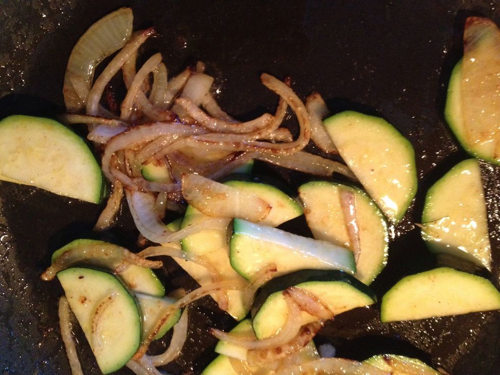Add zucchini to onions. Add 1/2 tsp each salt n pepper. Stir up!