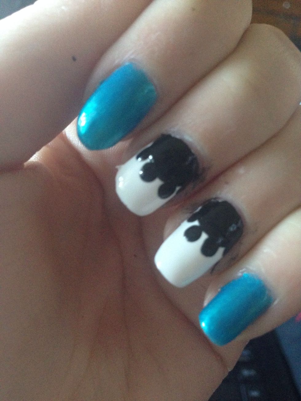 Add3 or 4 black dots along the outer edge of the circle.