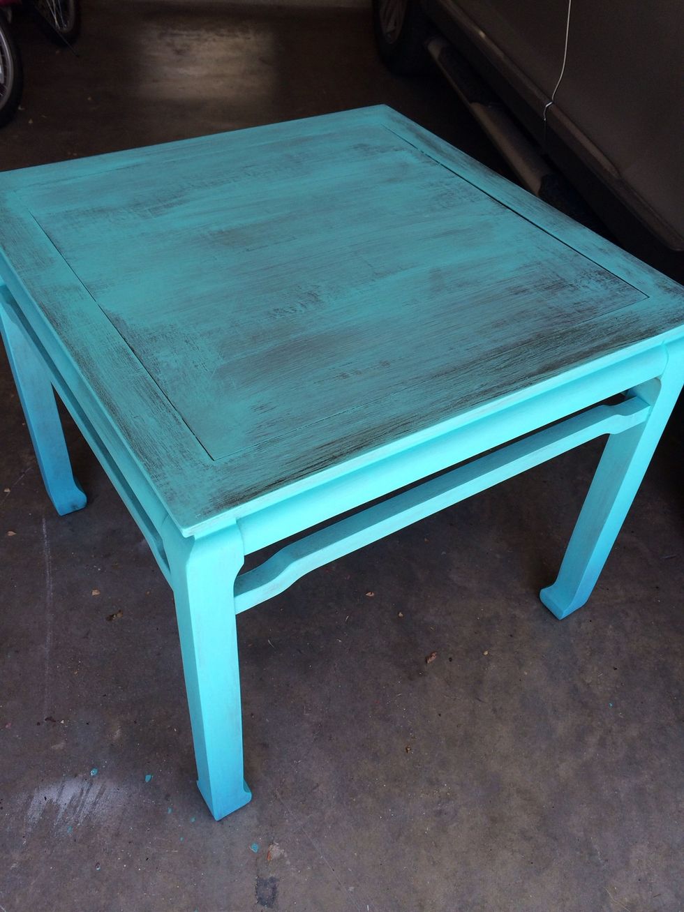 Added a coat of paint on top of stain. I had tried using stain on legs to distress, but did not like the results. So I repainted the legs also. Oops. Trial and error.