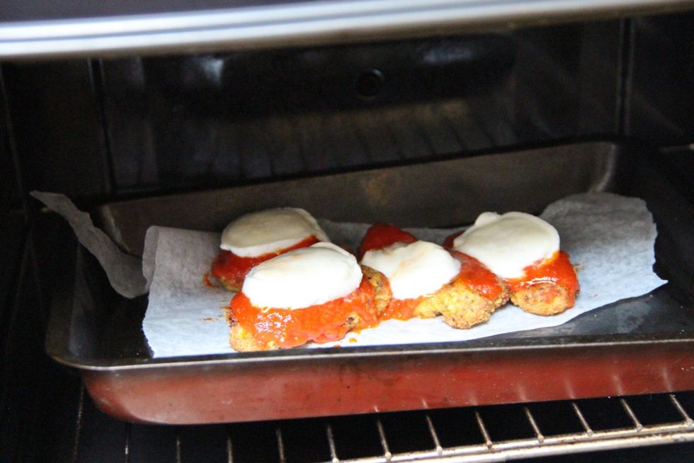 Added a few slices of mozzarella di bufalo minutes before taking out
