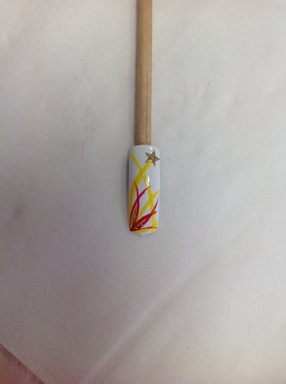 Added a gold glitter nail sticker in the top rot corner to finish off the nail art design.