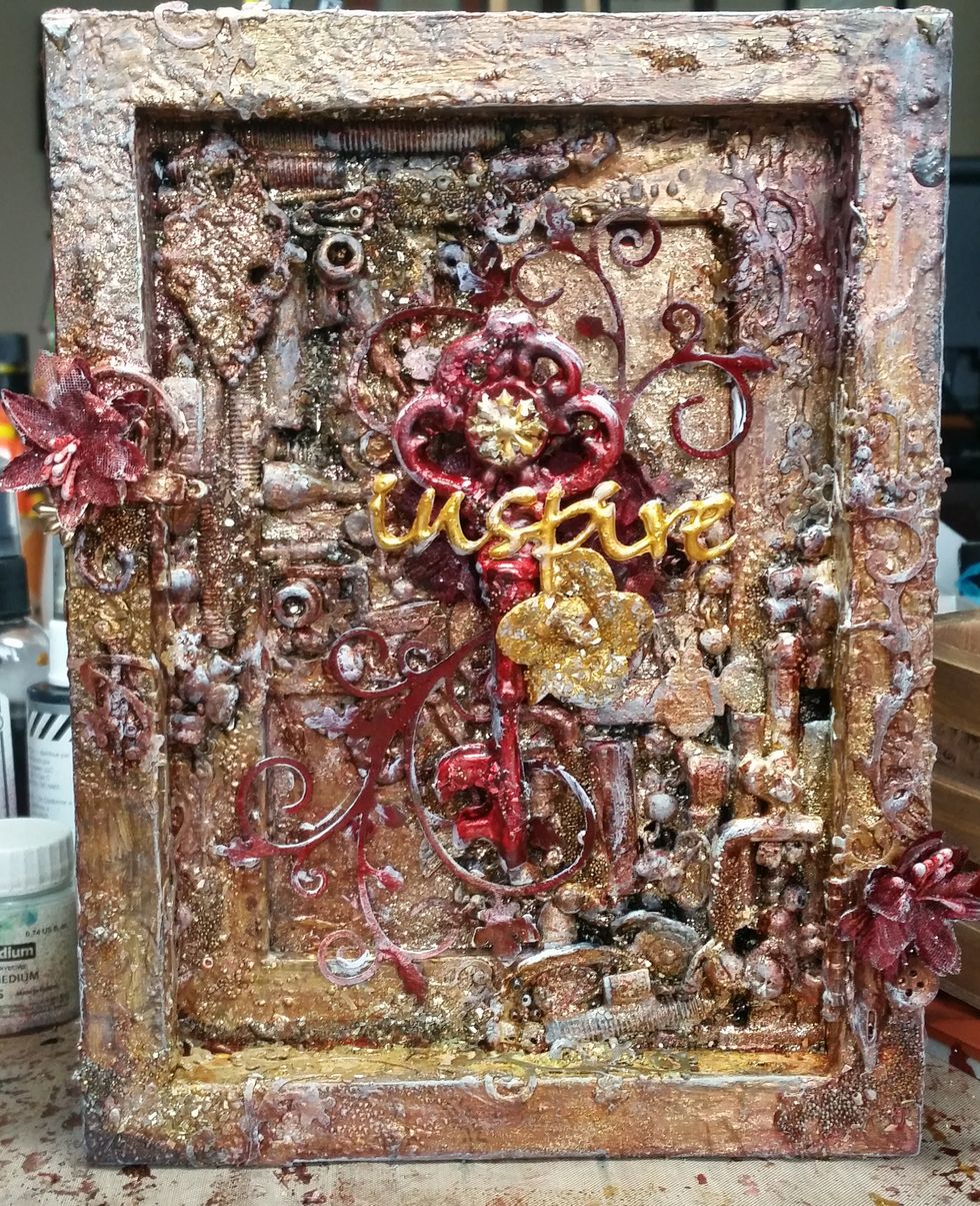 Added a Paper House Star Sticker to the key (with some Gold Glimmer Glam) and painted the red flowers under the Key in Roses R Red and glued everything down with molding paste.