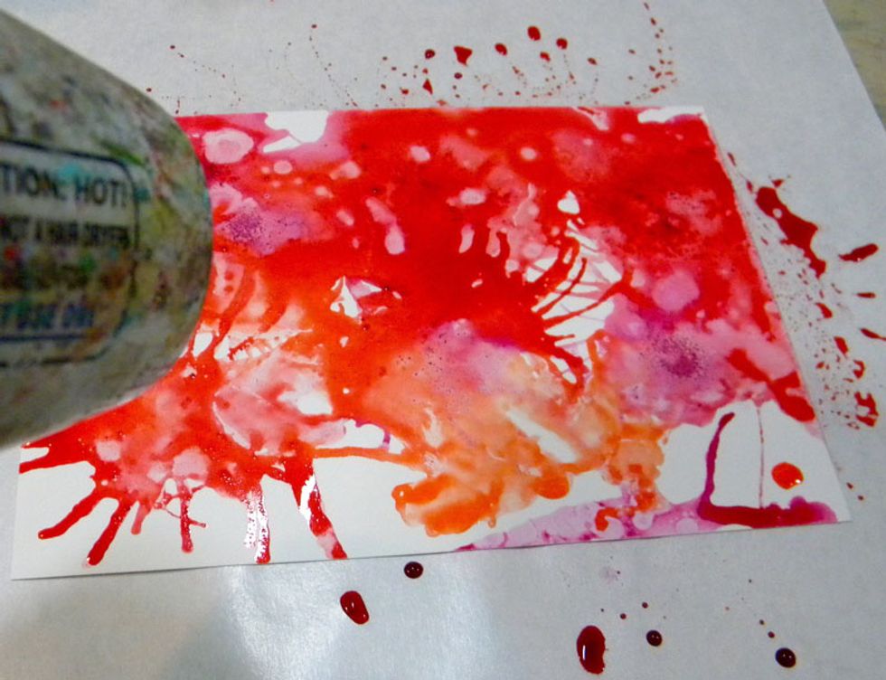 Adding a small amount of orange, or Radiance, I continued to blow with the straw until I liked the pattern. Use a heat tool to set the pattern in place. It can take a long time to dry!