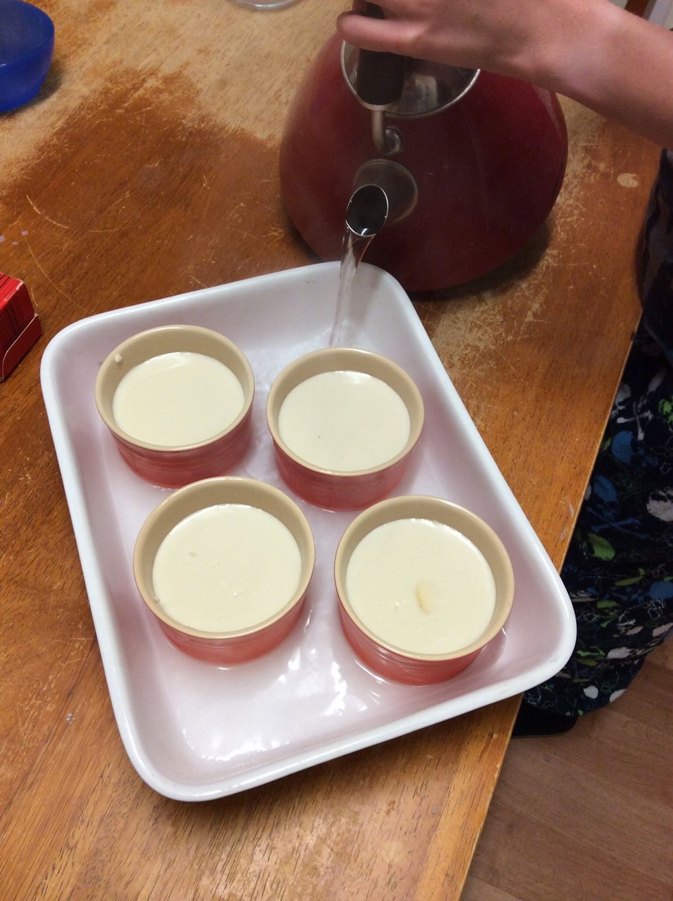 Adding boiling water in the baking dish