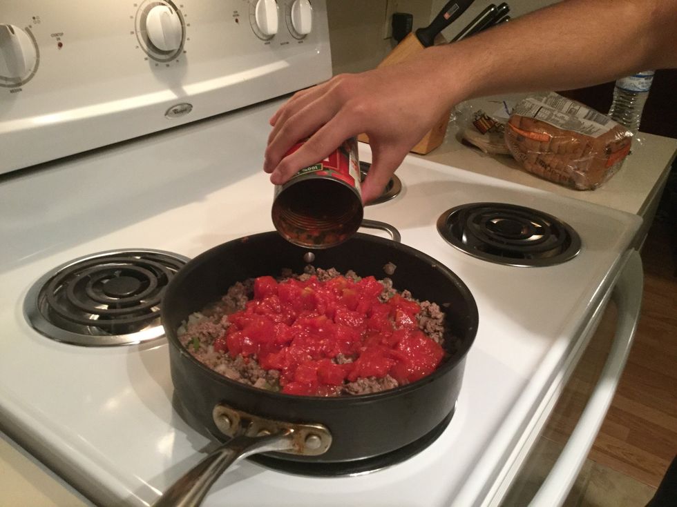 Adding diced tomato slices