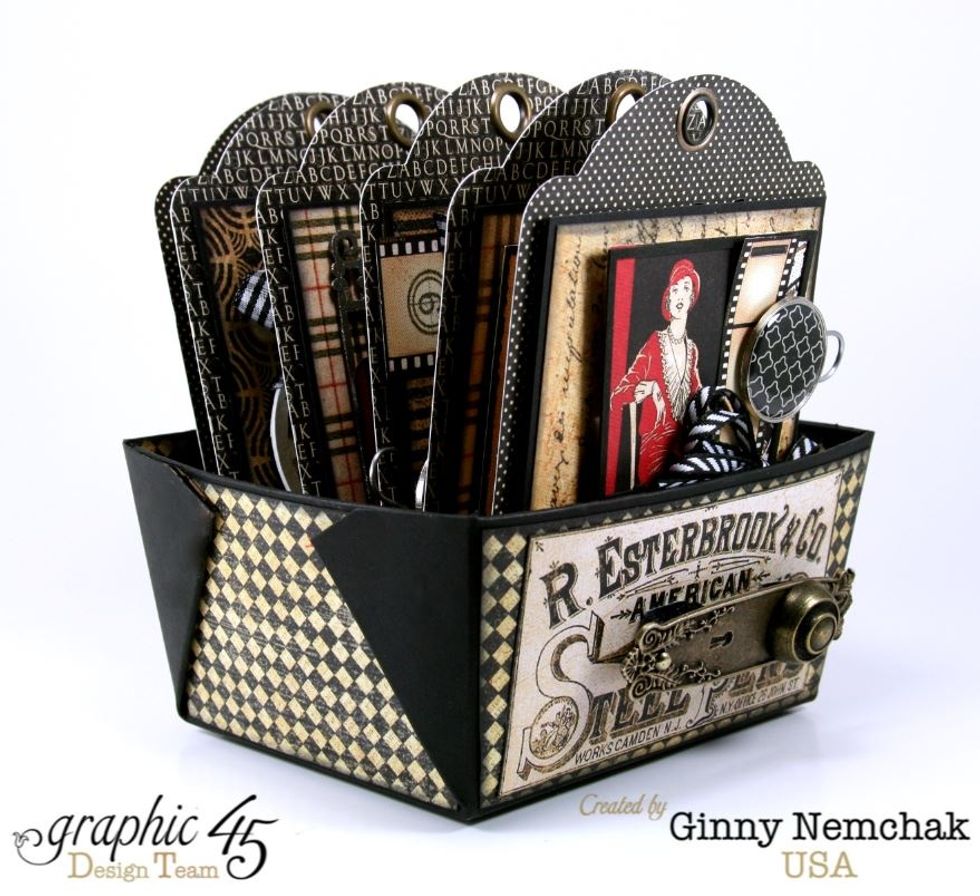 Adding lots of chipboard spacers will create nice sturdy bulky tags that fill in the box better and help to support them in the box without additional structure being added to the box.