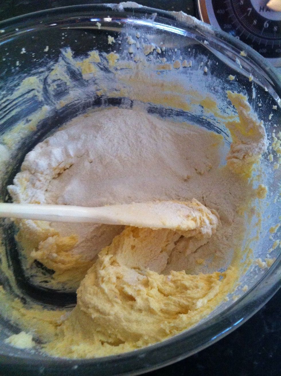 Adding the flour incrementally, and alternately with the eggs