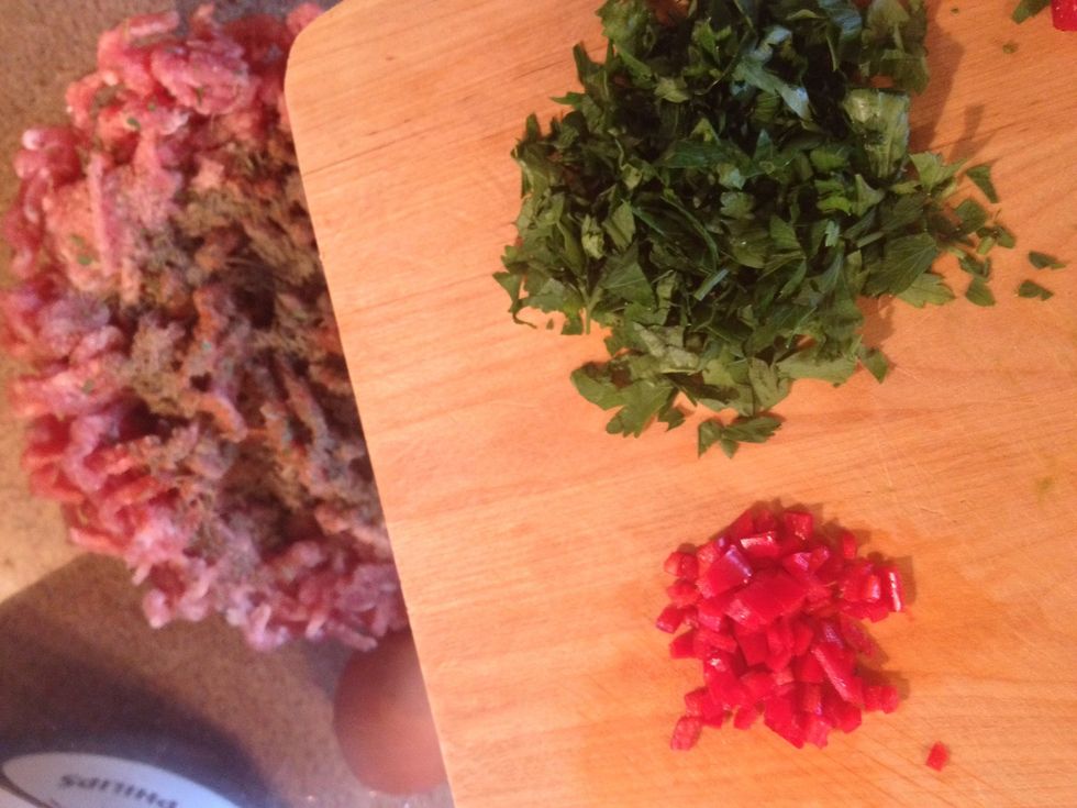 Adding to meat ,salt ,pepper,1pepperoni,some parsley,thyme