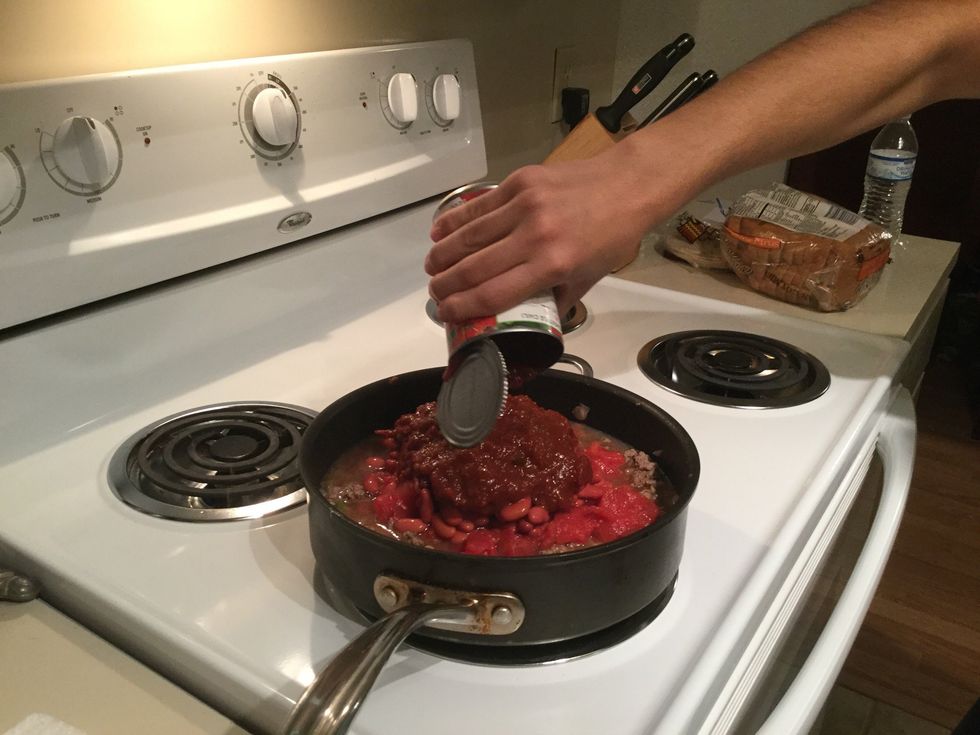 Adding tomato sauce