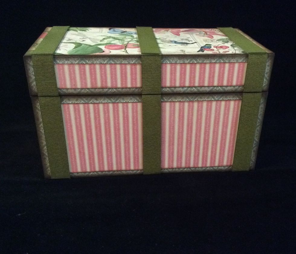Adhere 1/2 inch strips to box in configuration action shown. Adhere to the front, top, and back. Not to short sides and and bottom.