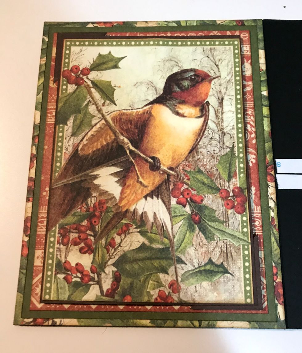 Adhere 3 3/8" x 4 5/8" image to 3 3/8" x 4 3/4" piece of brown paper. Create photo corner from brown paper. Adhere in top left corner of brown paper. Foam square brown paper to red border paper.